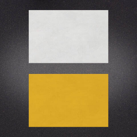 White over Yellow preformed thermoplastic example ontop of plastic showing relative sizes of 24 inches by 36 inches