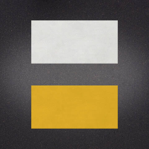 White over Yellow preformed thermoplastic example ontop of plastic showing relative sizes of 18 inches by 36 inches