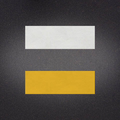 White over Yellow preformed thermoplastic example ontop of plastic showing relative sizes of 12 inches by 36 inches