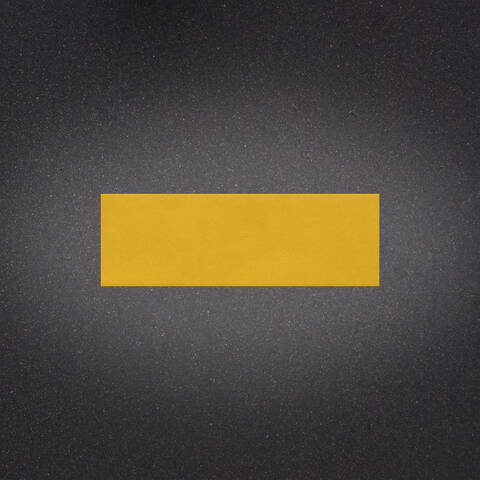 Stylish asphalt background with a yellow line representing a 12 inches by 3 foot Ennis-Flint Premark XF thermoplastic line