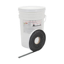 image: Roll of 1" QuikJoint Asphalt Crack Tape in front of bucket