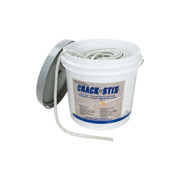 Overview of the 225 foot quarter inch gray Crack Stix with the lid off and product snaking out of the bucket for display