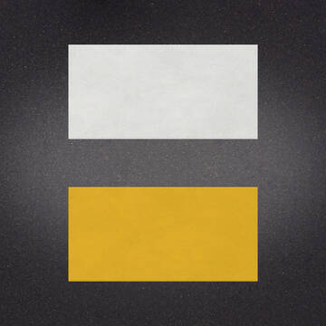 White over Yellow preformed thermoplastic example ontop of plastic showing relative sizes of 18 inches by 36 inches