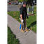 Overview of a man walking with a hand torch applying heat to the Crack Stix on a concrete joint.