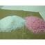 image of two small piles of premium ice and snow melt, one is undyed and the other is dyed pink